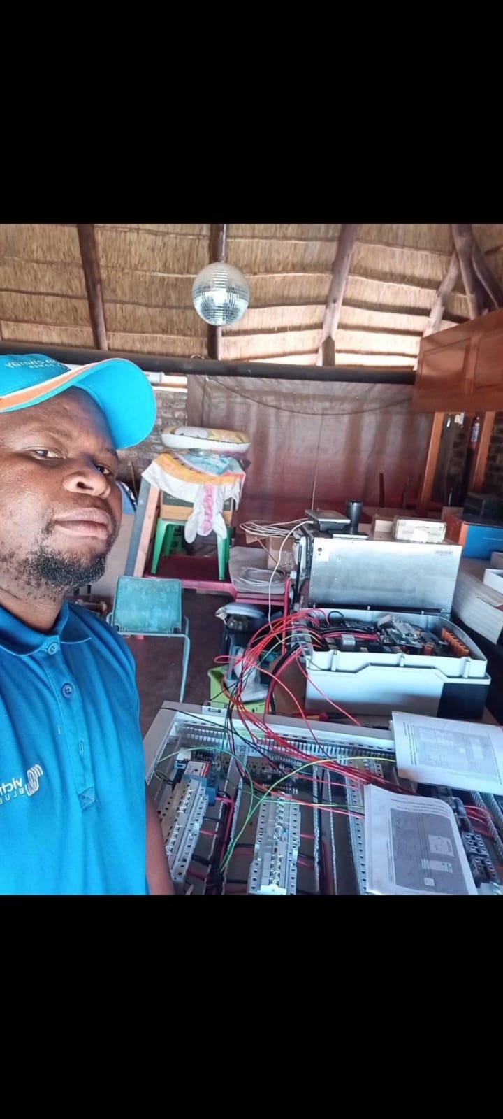 Electrician working on a distribution board and control wiring